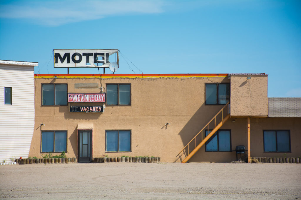 Old Motel with "Have a Nice Day" sign.
